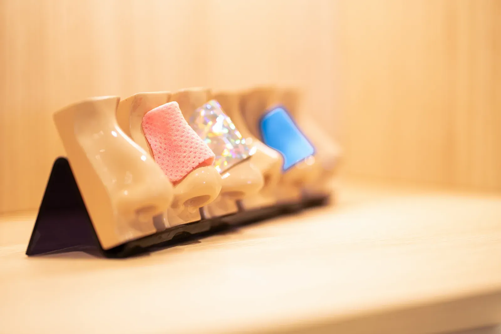 Anatomical models of noses on light wooden furniture at the clinic